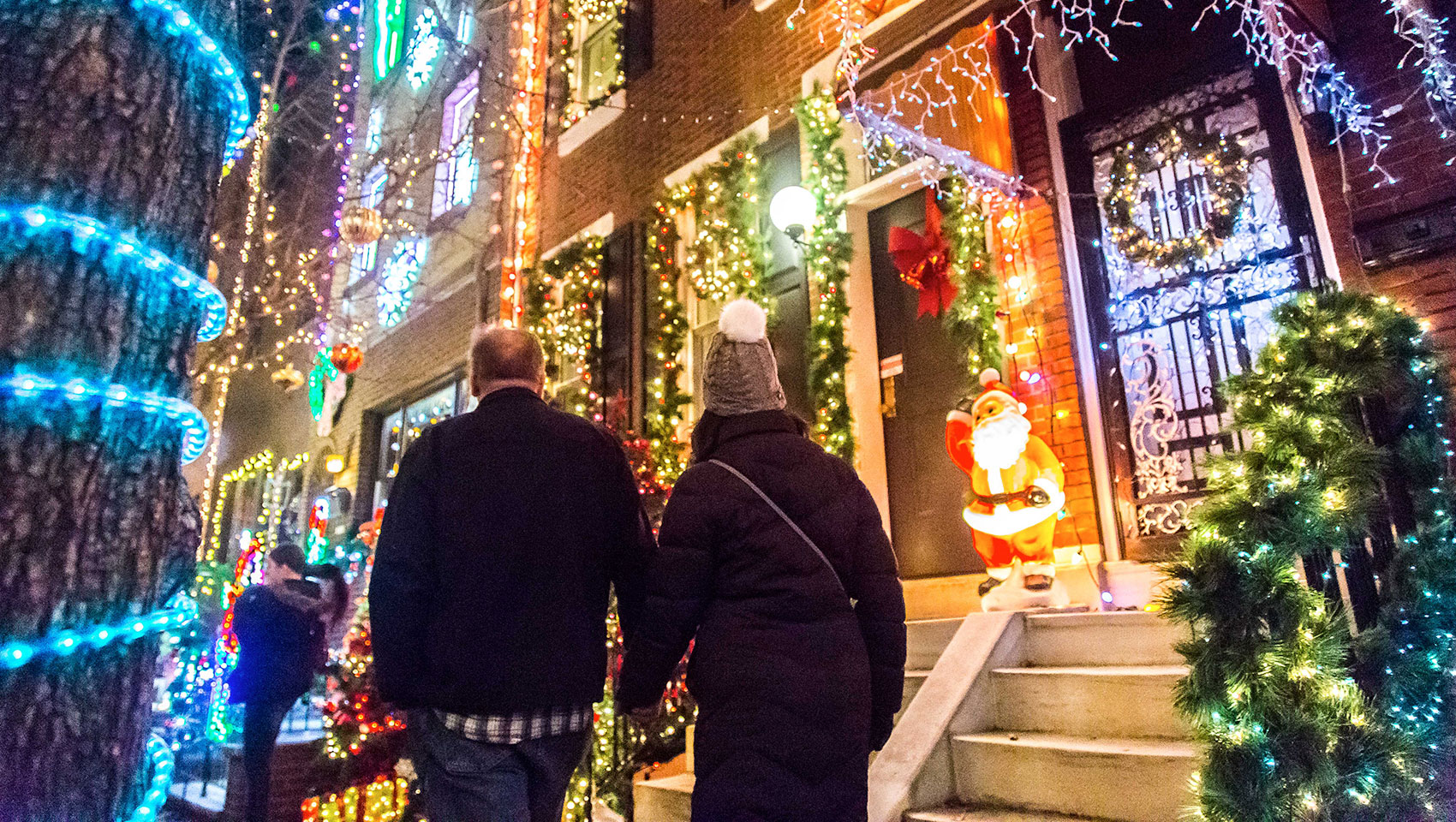 People looking at homes with holiday decor