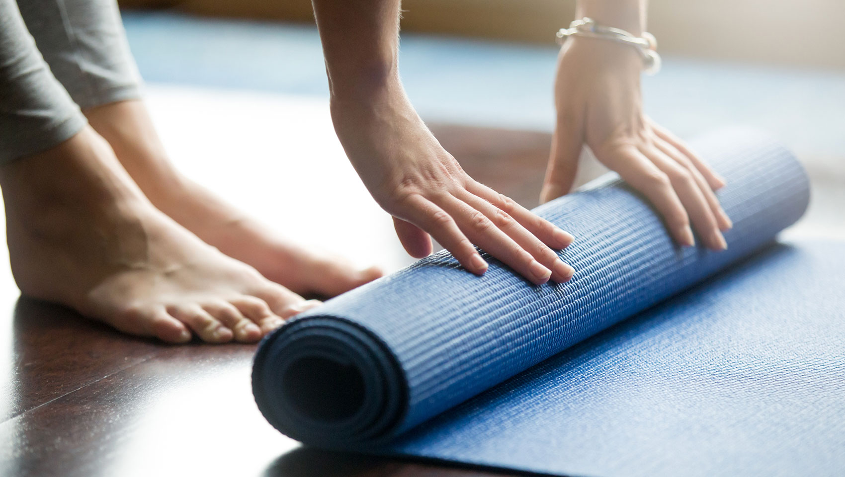 unrolling a yoga mat