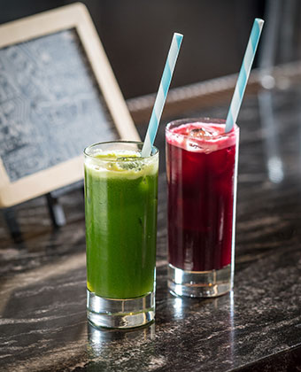 2 Glasses with fresh red juice and green juice