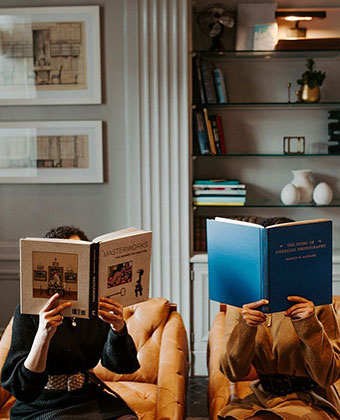 People reading books in the hotel library