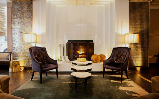 Kimpton Hotel Palomar Philadelphia's lobby area with seating and fireplace